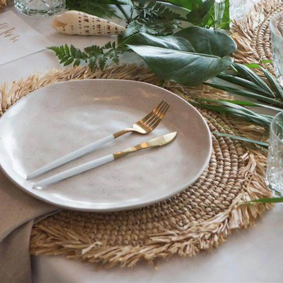 PLACEMATS - BOHO WOVEN SEAGRASS RATTAN WITH FRINGE - Bon + Co. Party Studio  Inc.